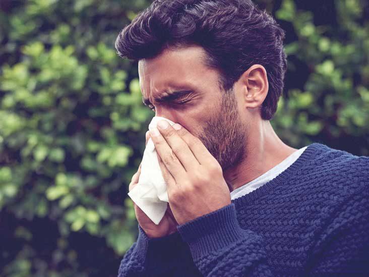 man sneezing