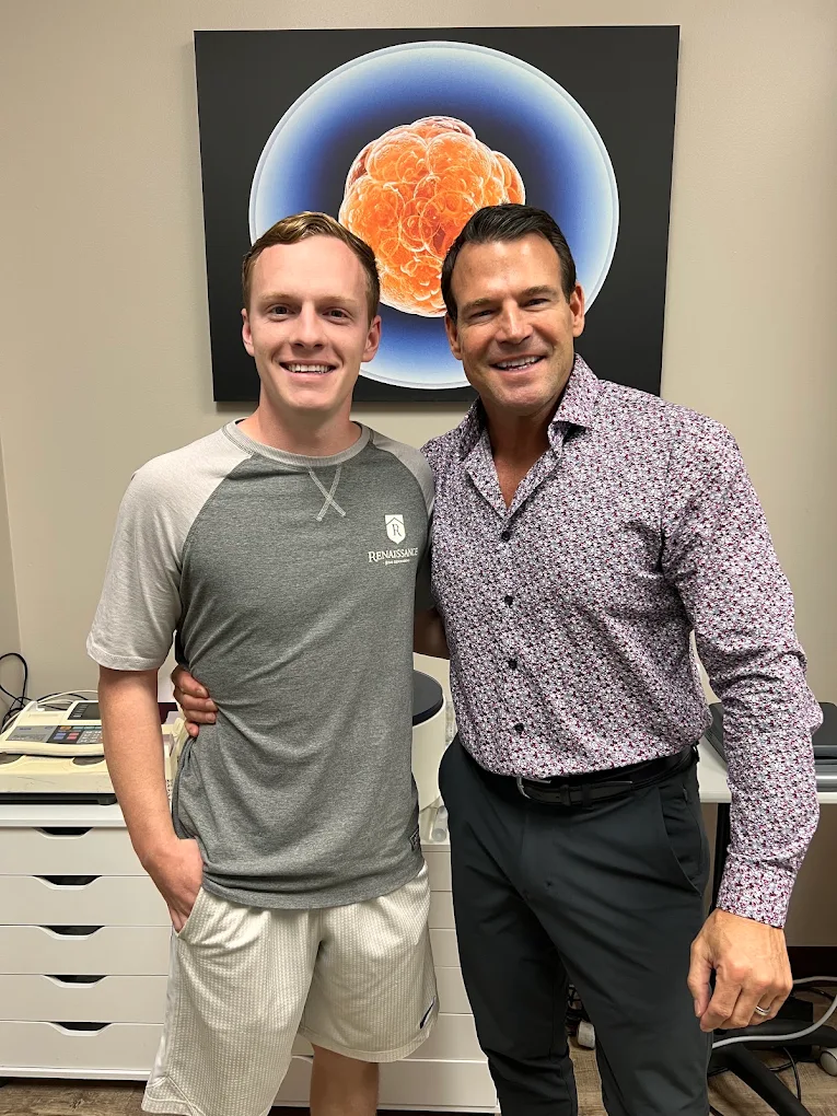 Pain Relief Evaluation - Cincinnati Ohio Chiropractor Dr. Baker with a smiling patient in the Baker Chiropractic office